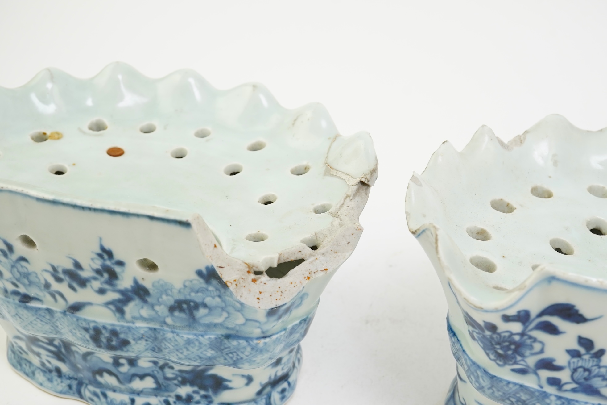 A pair of unusual Chinese export blue and white bough pots, after a Delft model, Qianlong period